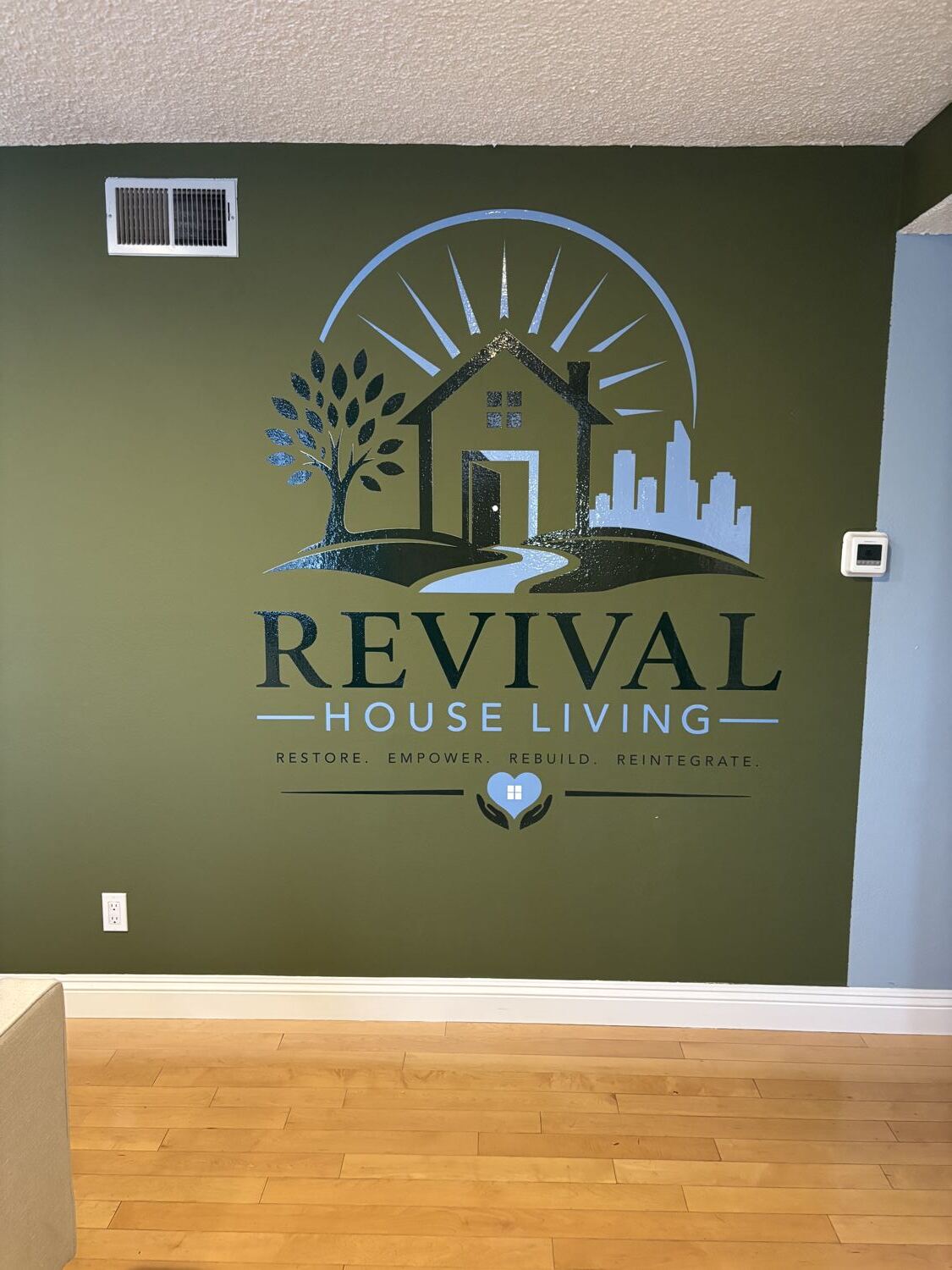 Revival House Living logo on the wall